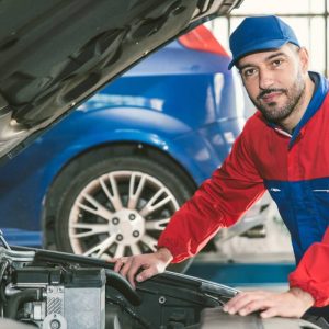 A man repairing a vehicle
